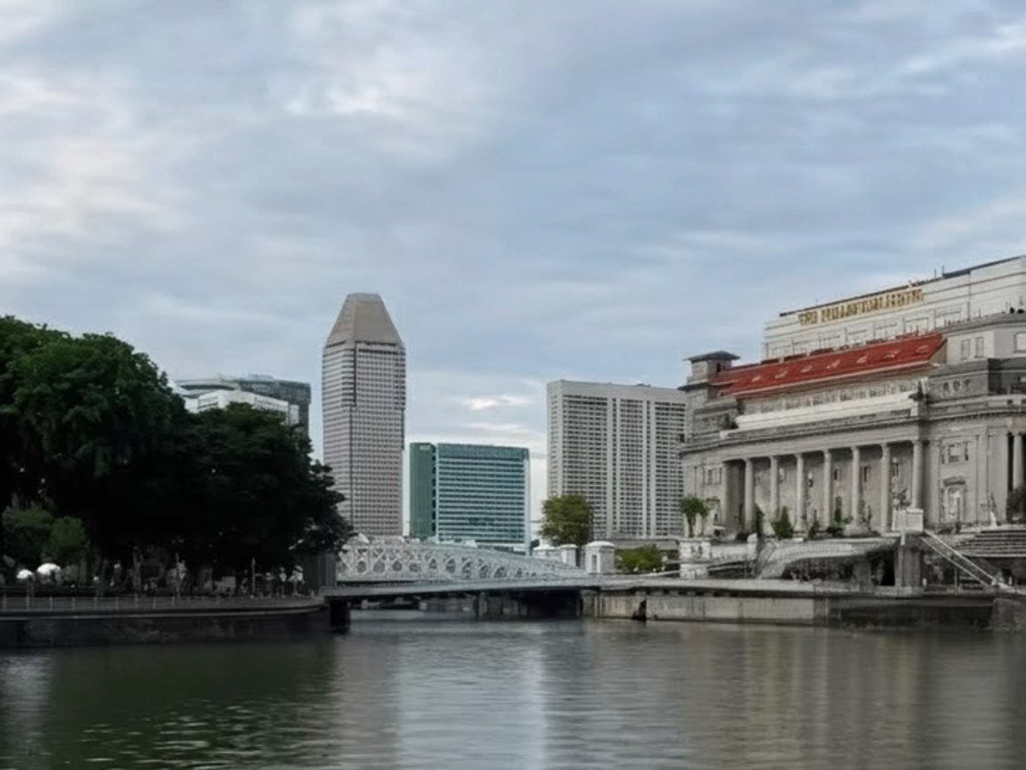 View of Singapore River towering buildings and a bridge from the 1800s